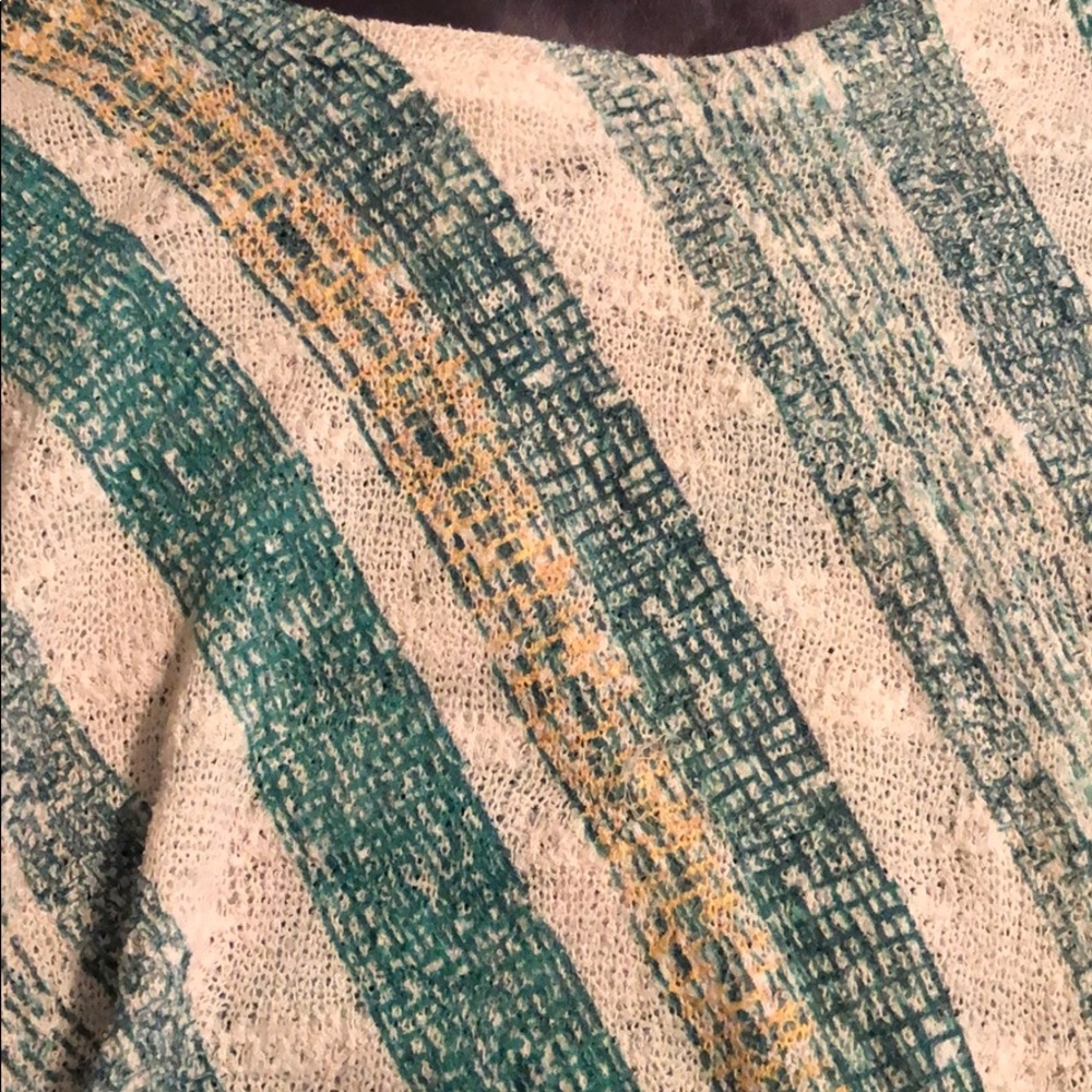 3/4 length sleeve and angled hemline